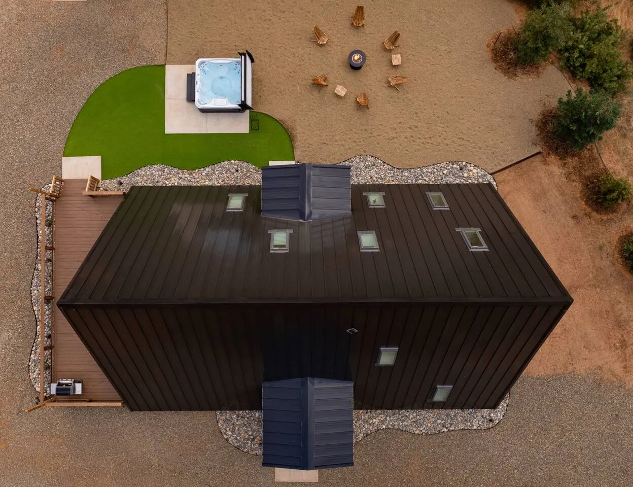 Aerial view of the cabin, deck, hot tub and fire pit
